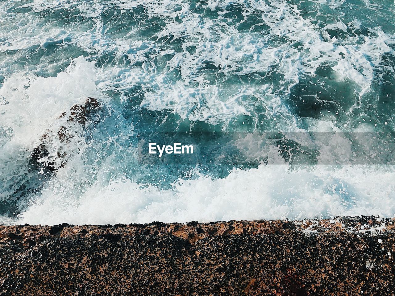 WAVES SPLASHING ON ROCKS