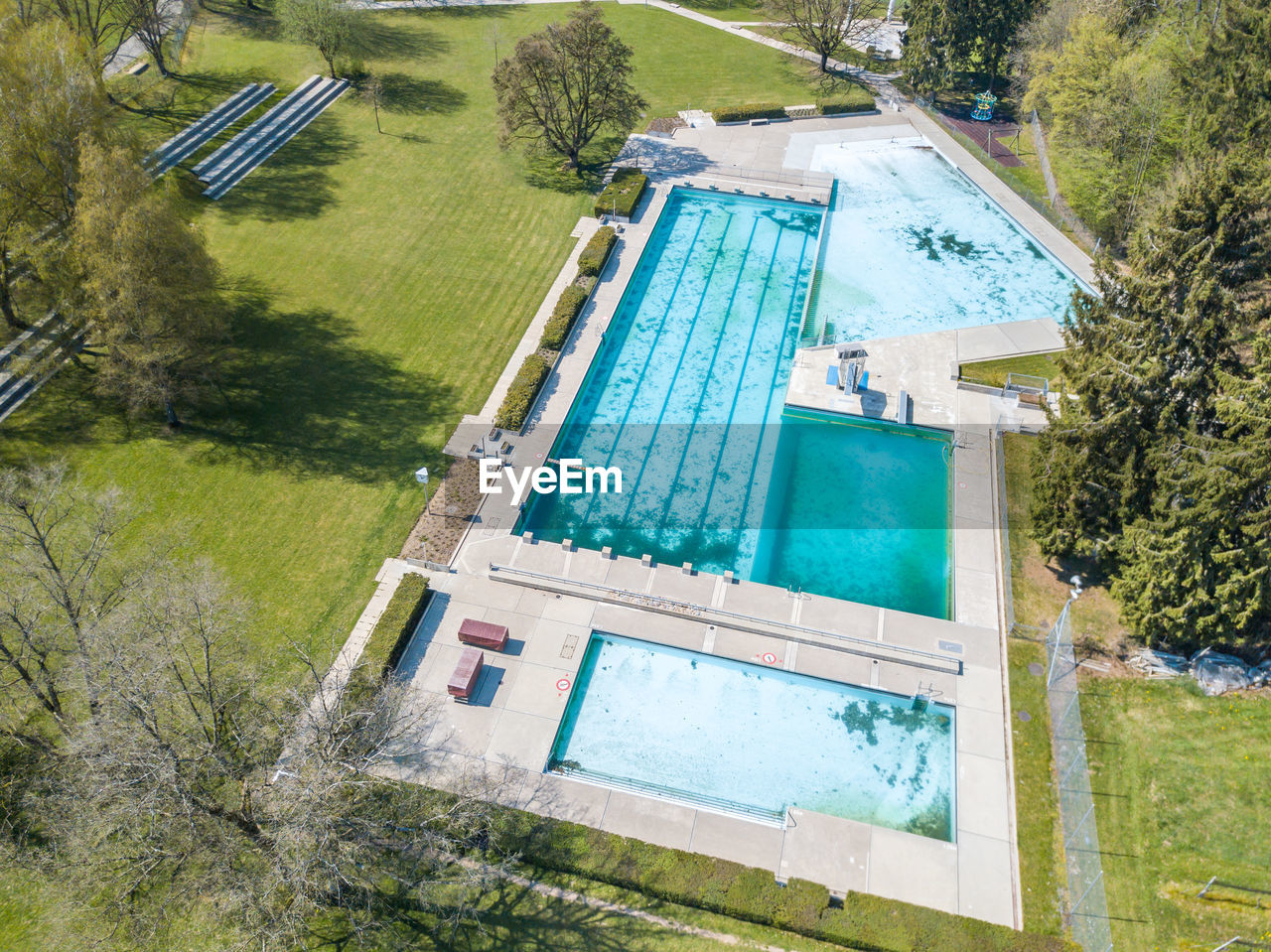 HIGH ANGLE VIEW OF SWIMMING POOL AT FIELD