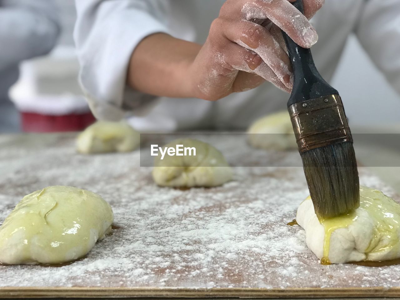 EyeEmNewHere Baking Bread Class Chopping Close-up Dough Food Food And Drink Freshness Healthy Eating Holding Human Body Part Human Hand Indoors  Kneading Making Occupation Olive Oil One Person People Preparation  Preparing Food Real People Selective Focus Working