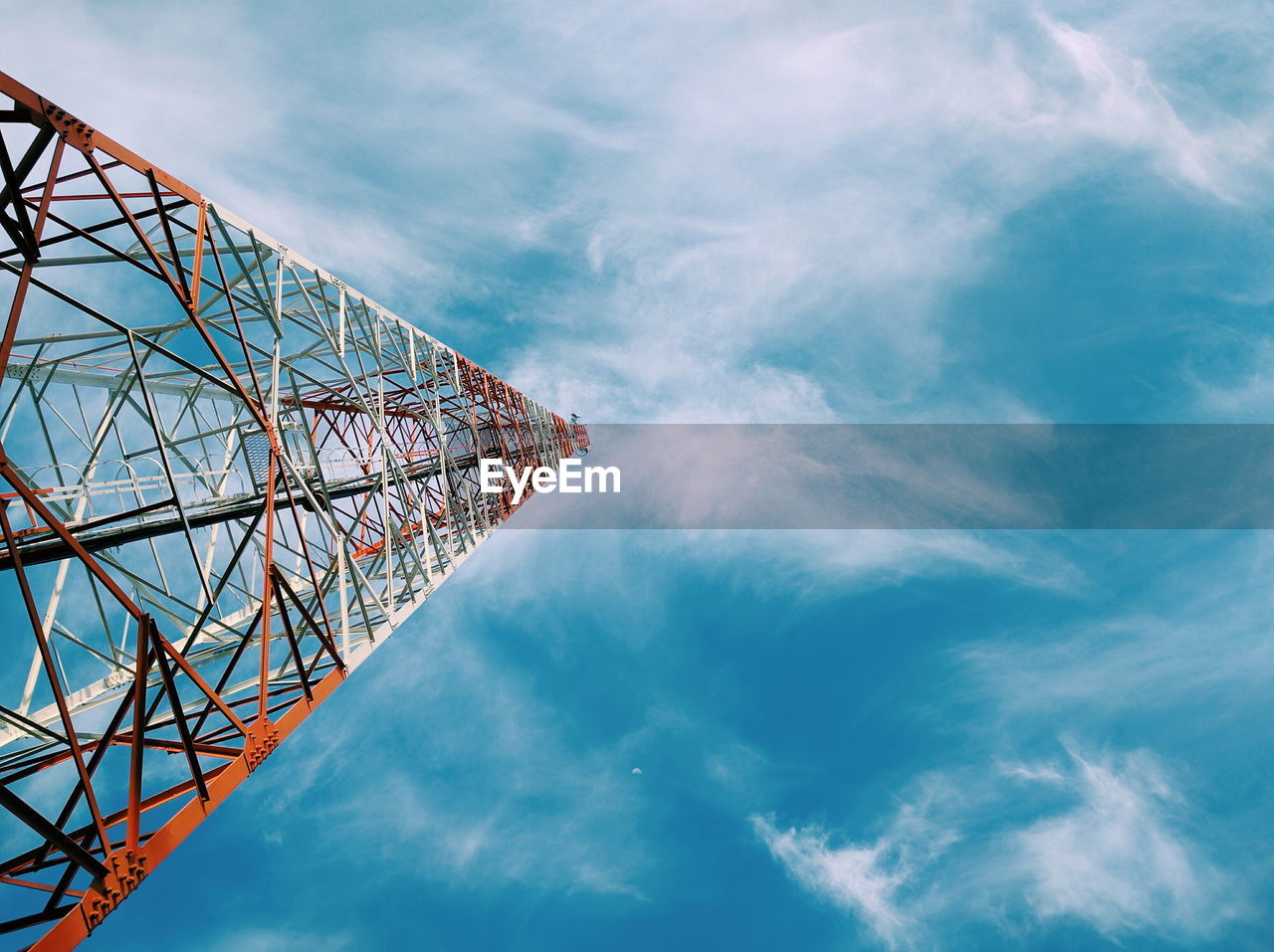 Low angle view of communications tower against sky