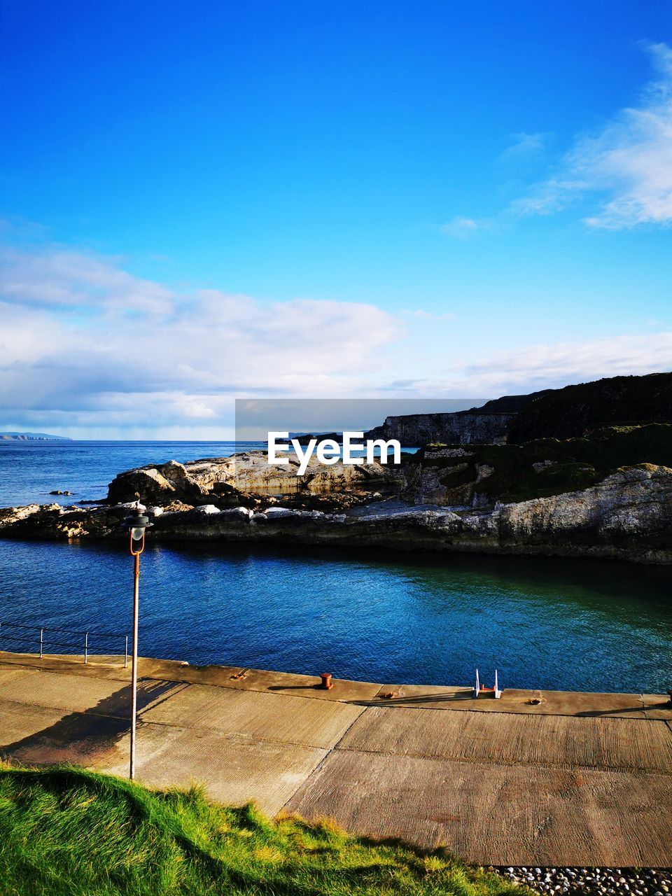 Scenic view of sea against blue sky