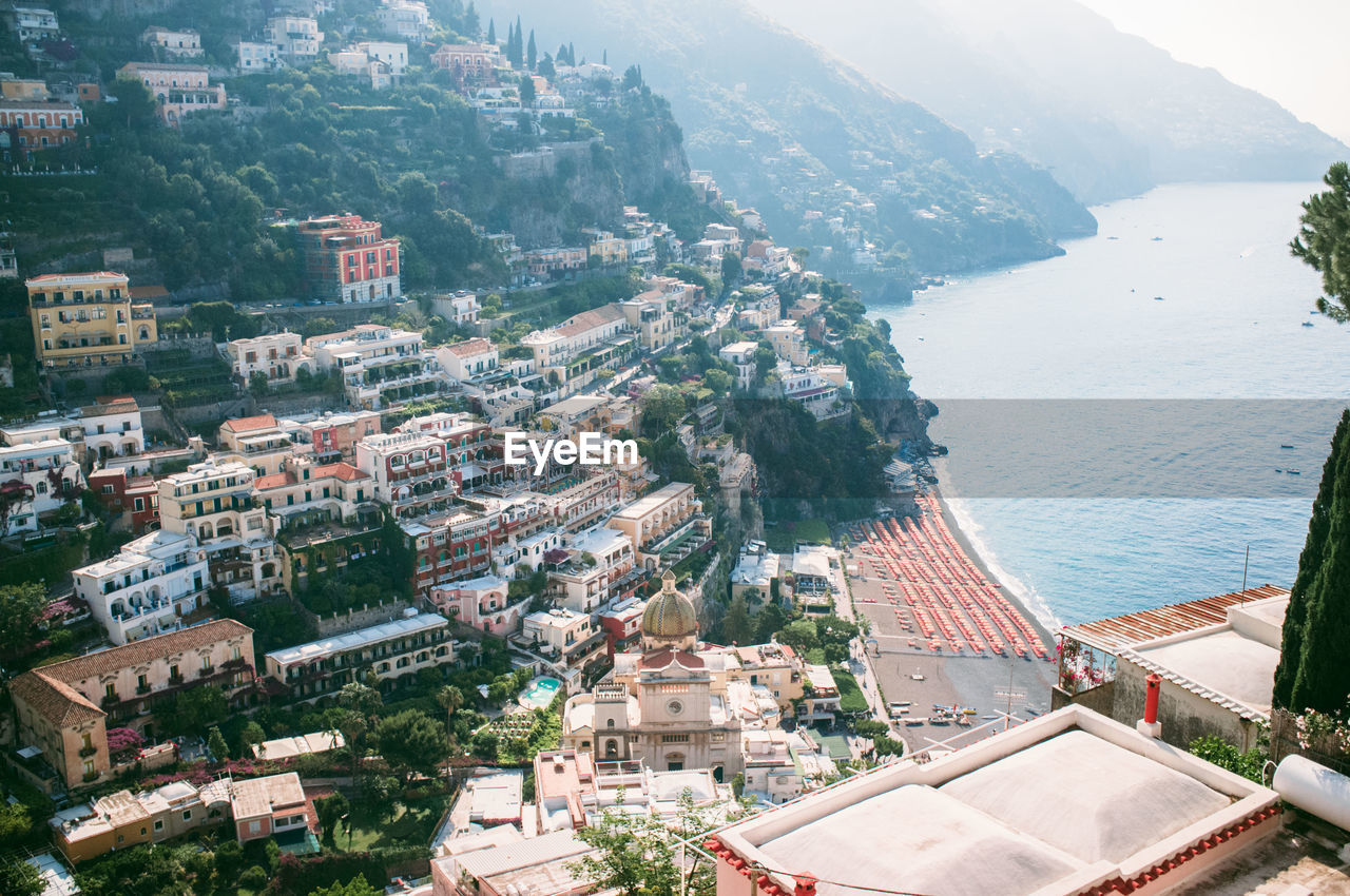 High angle view of buildings on mountains by sea at positano