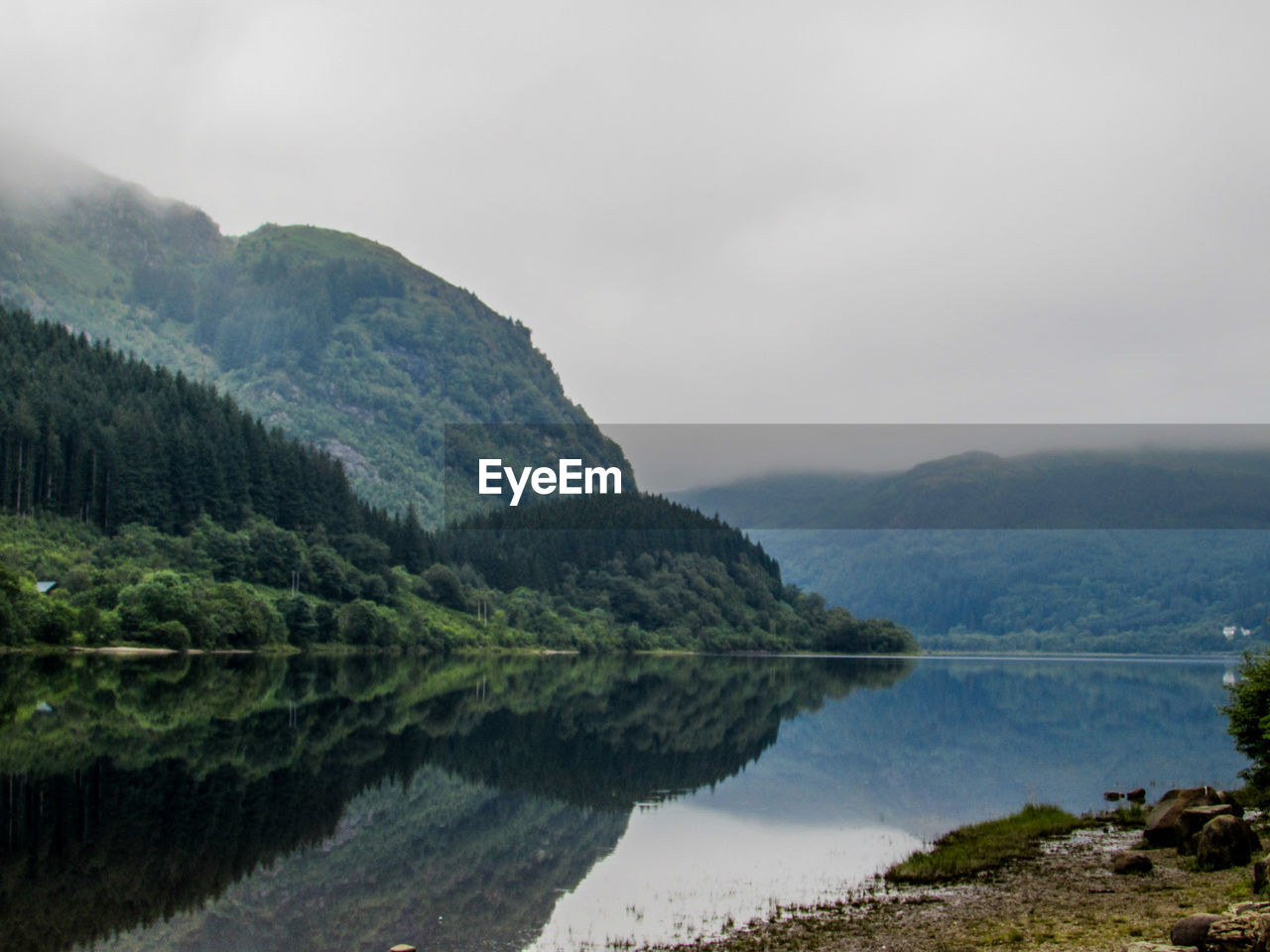 Scenic view of lake with mountains in background