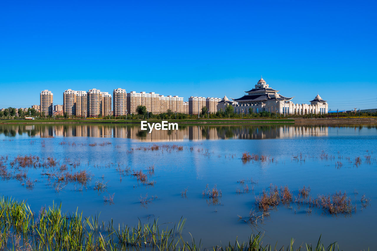 Reflection of buildings in lake