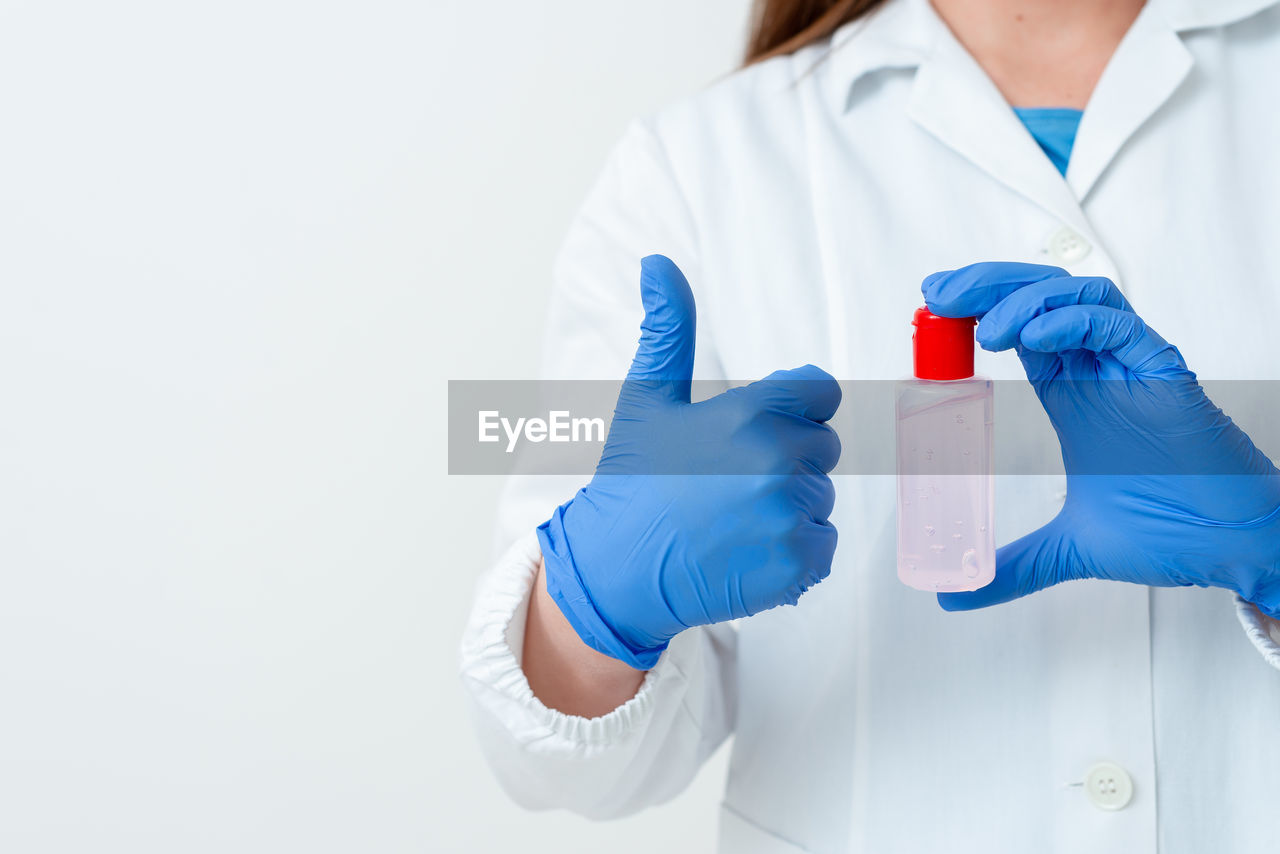 TWO PEOPLE WORKING ON WHITE BACKGROUND