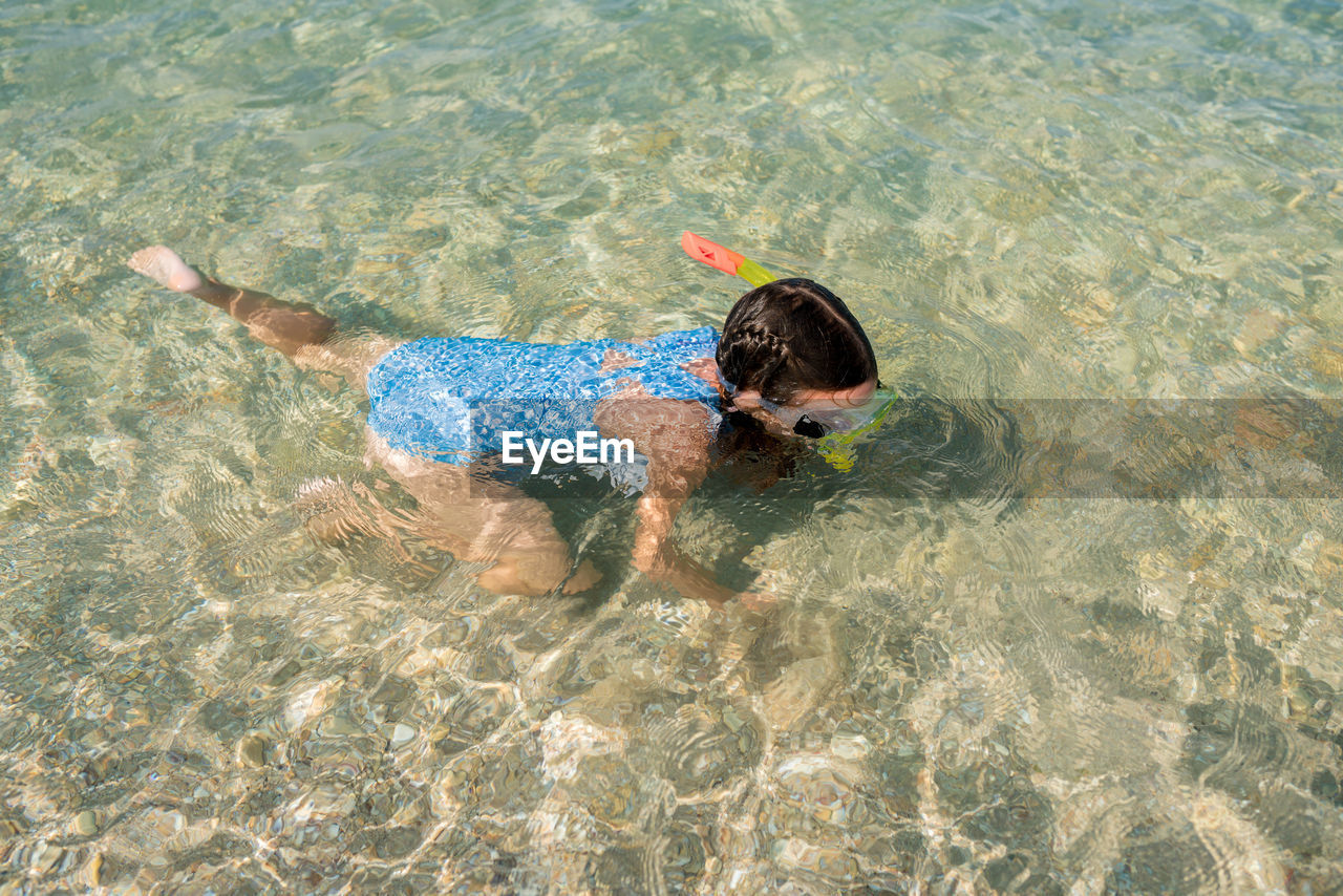 High angle view of girl swimming in sea