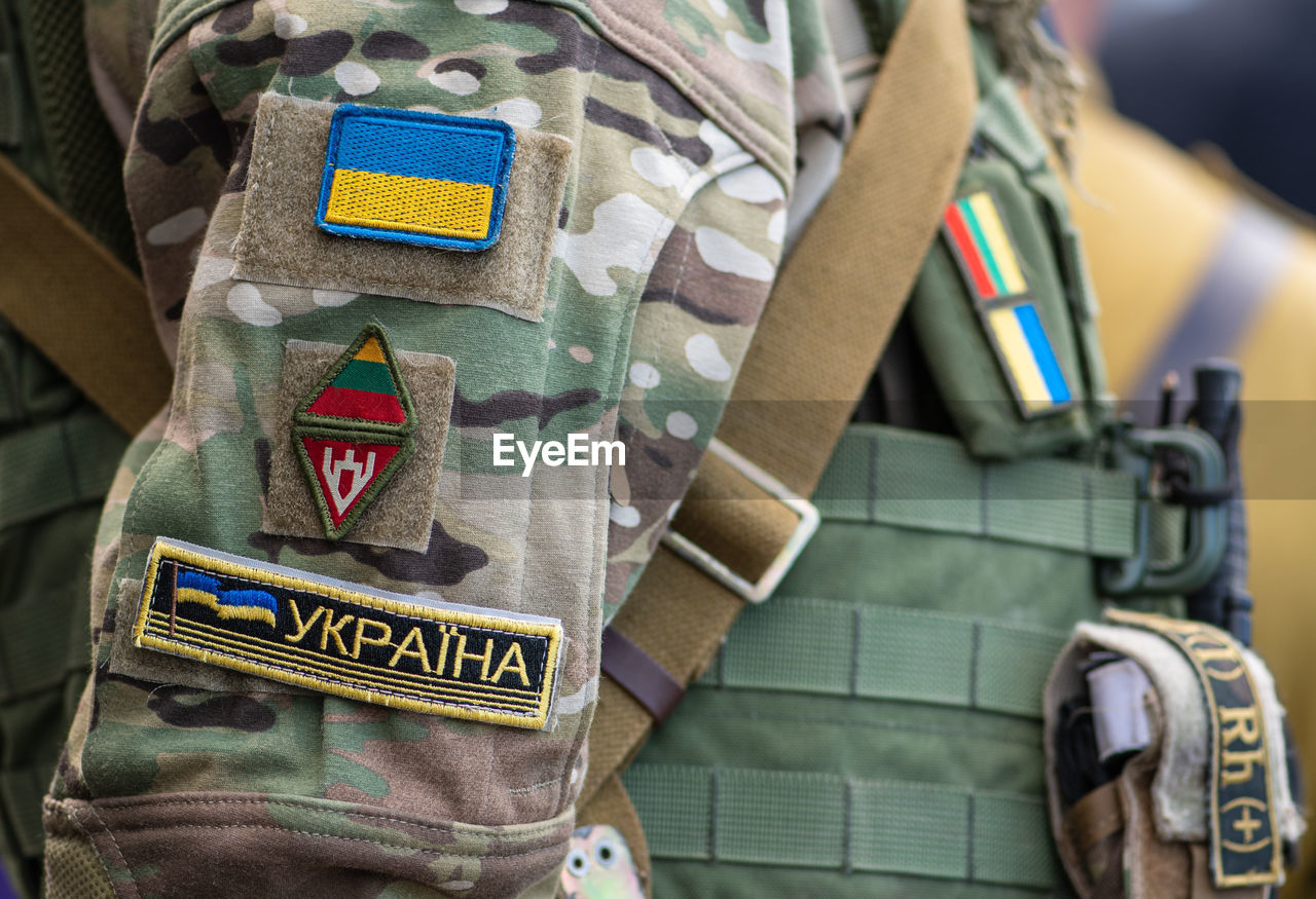 Flag of ukraine, ukrainian army or armed forces on a patch of a soldier military uniform, close up