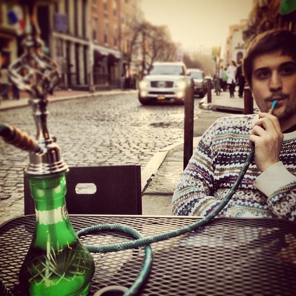 Portrait of a man smoking shisha