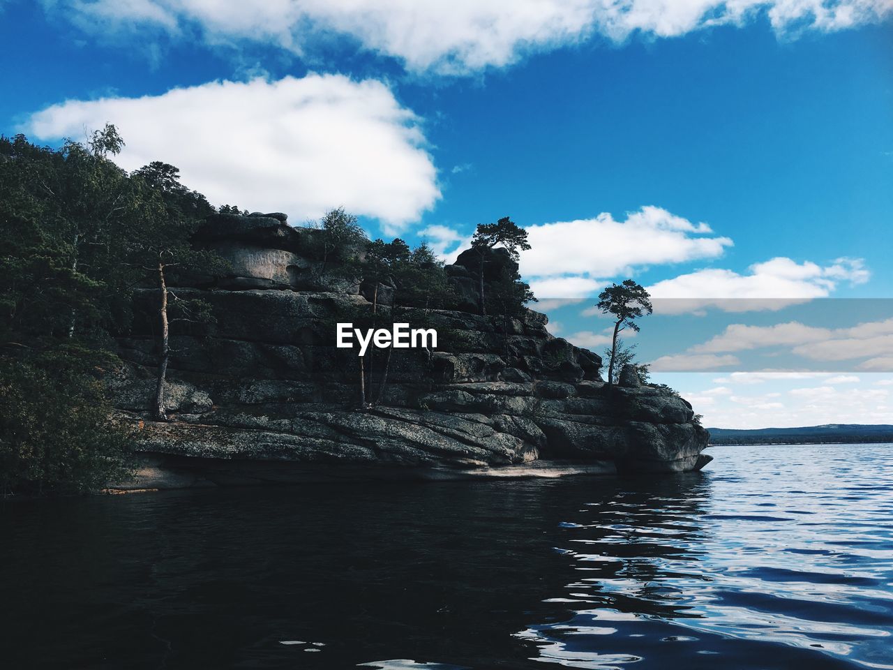 Scenic view of sea and rocks against sky