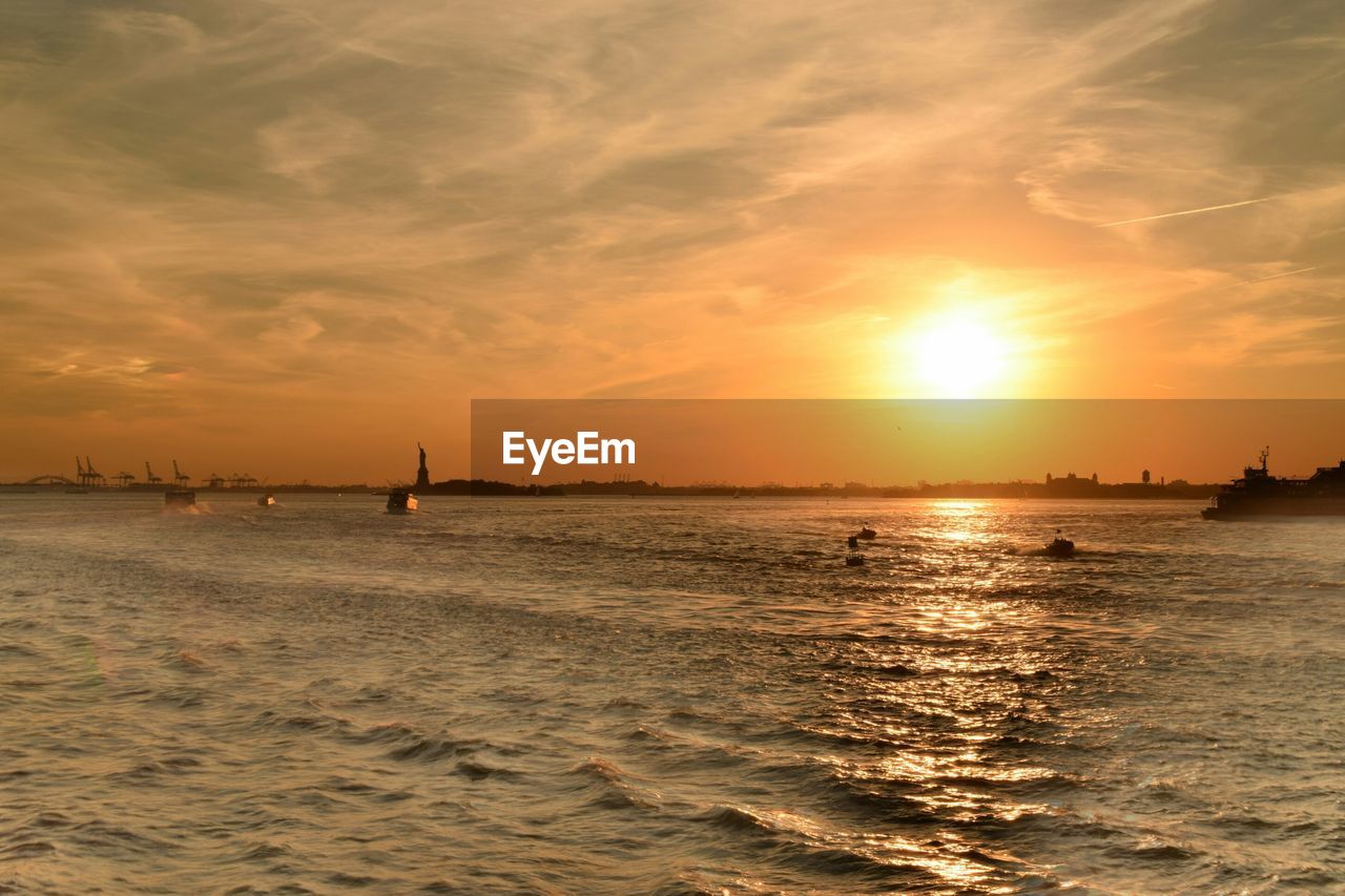 View of sea against orange sky during sunset