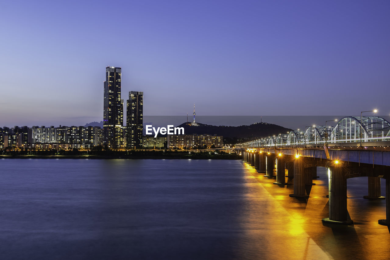 Illuminated buildings at waterfront