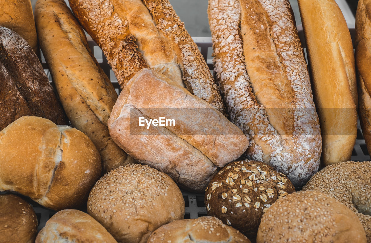 Various types of freshly baked bread arranged in the crate