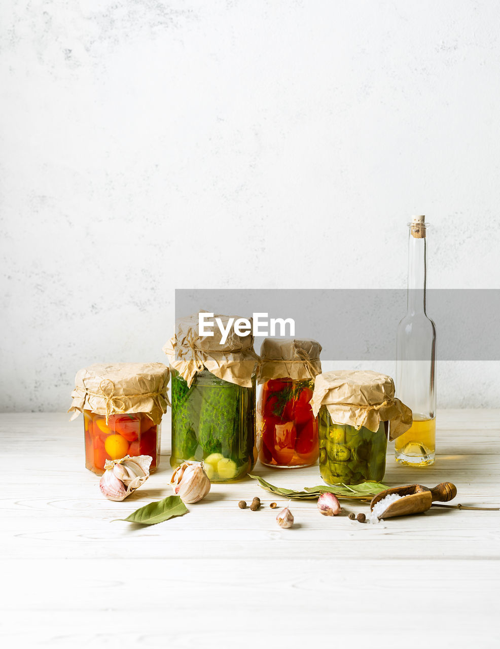 Assorted homemade vegetable preserves in glass jars