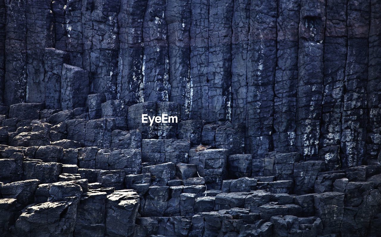 FULL FRAME SHOT OF ROCK FORMATION ON LAND