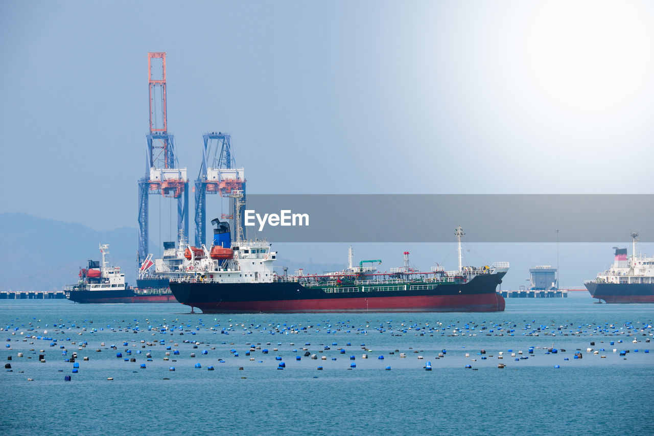 SHIP IN SEA AGAINST BLUE SKY