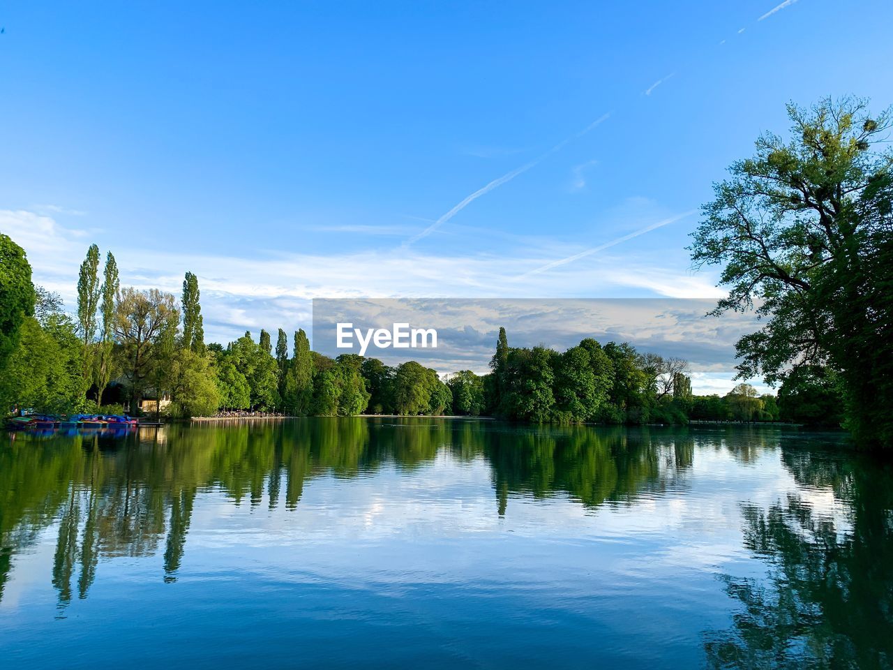 Scenic view of lake against blue sky