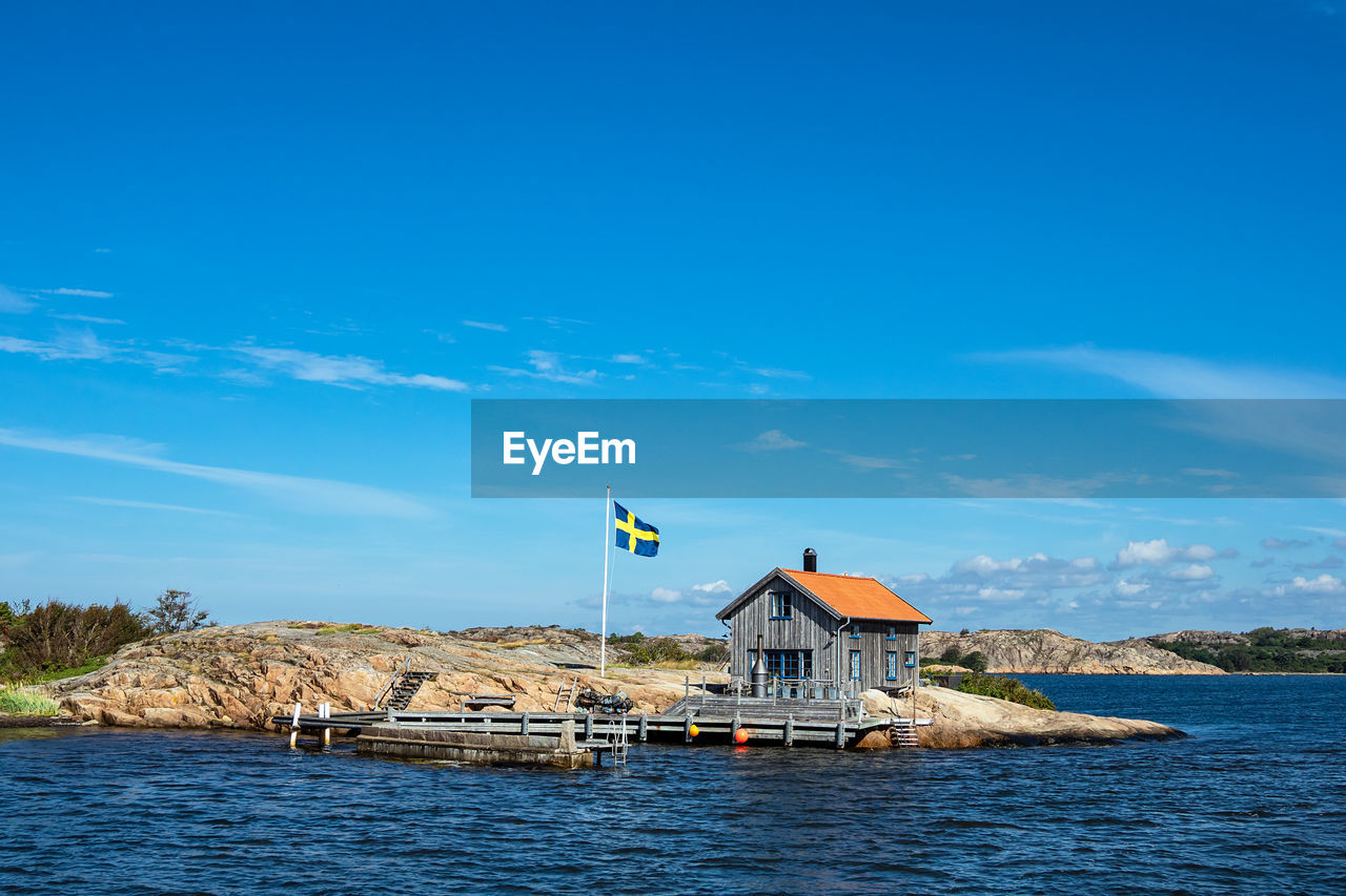 BUILT STRUCTURE ON SEA AGAINST SKY