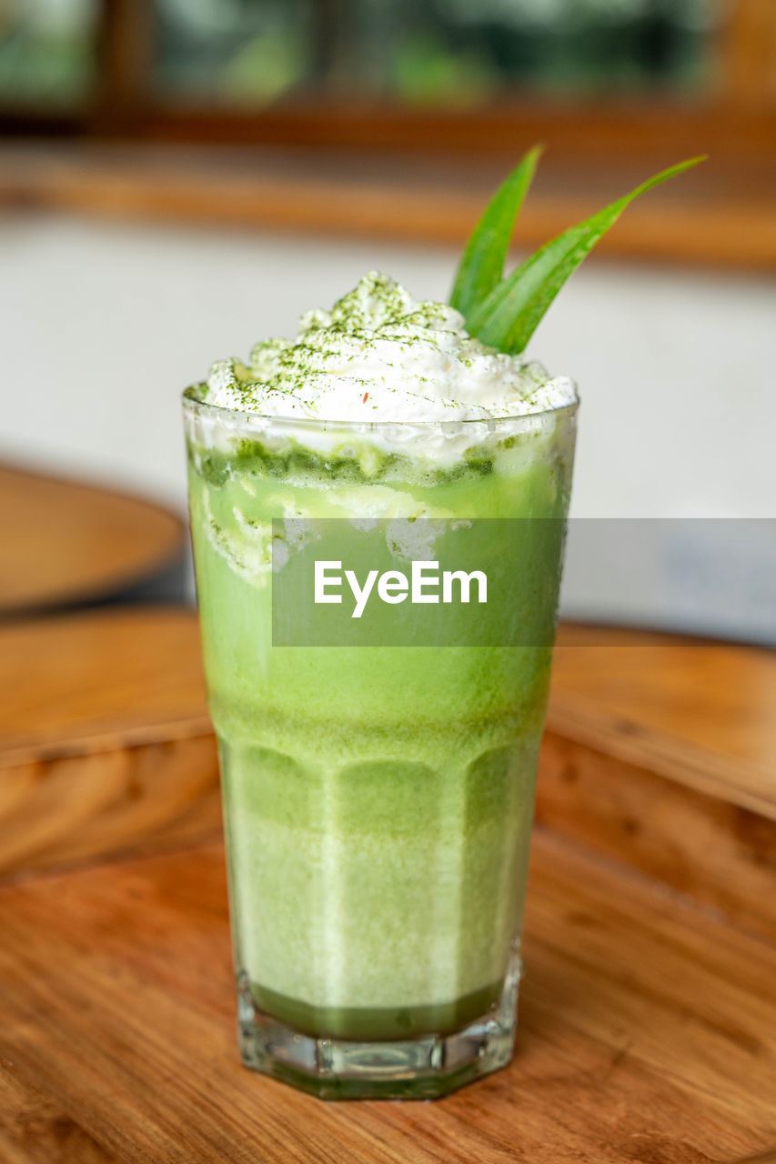 close-up of drink on wooden table