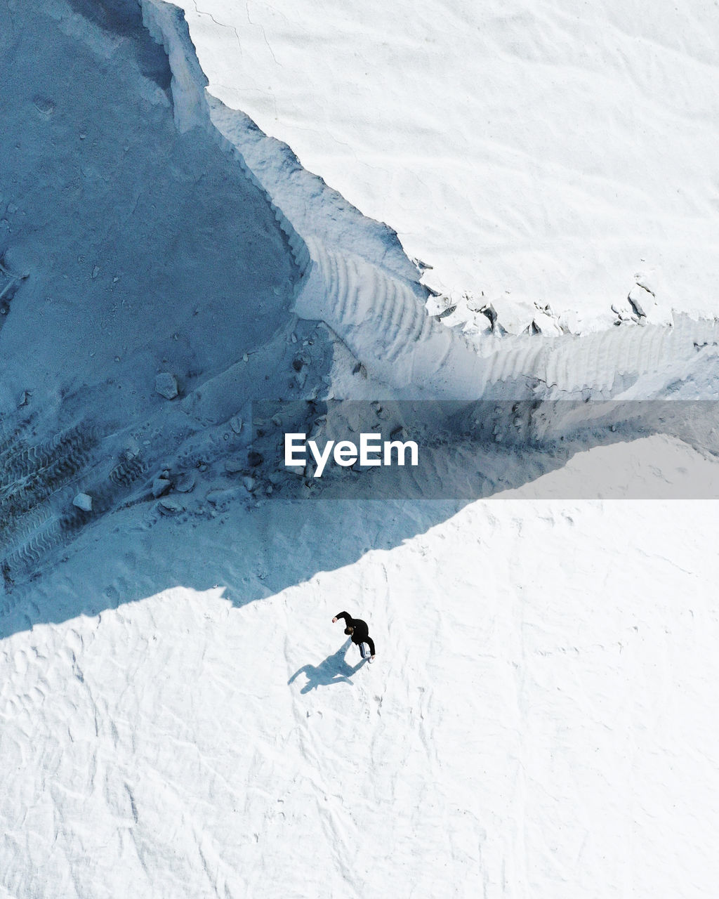 High angle view of person on snowcapped mountain