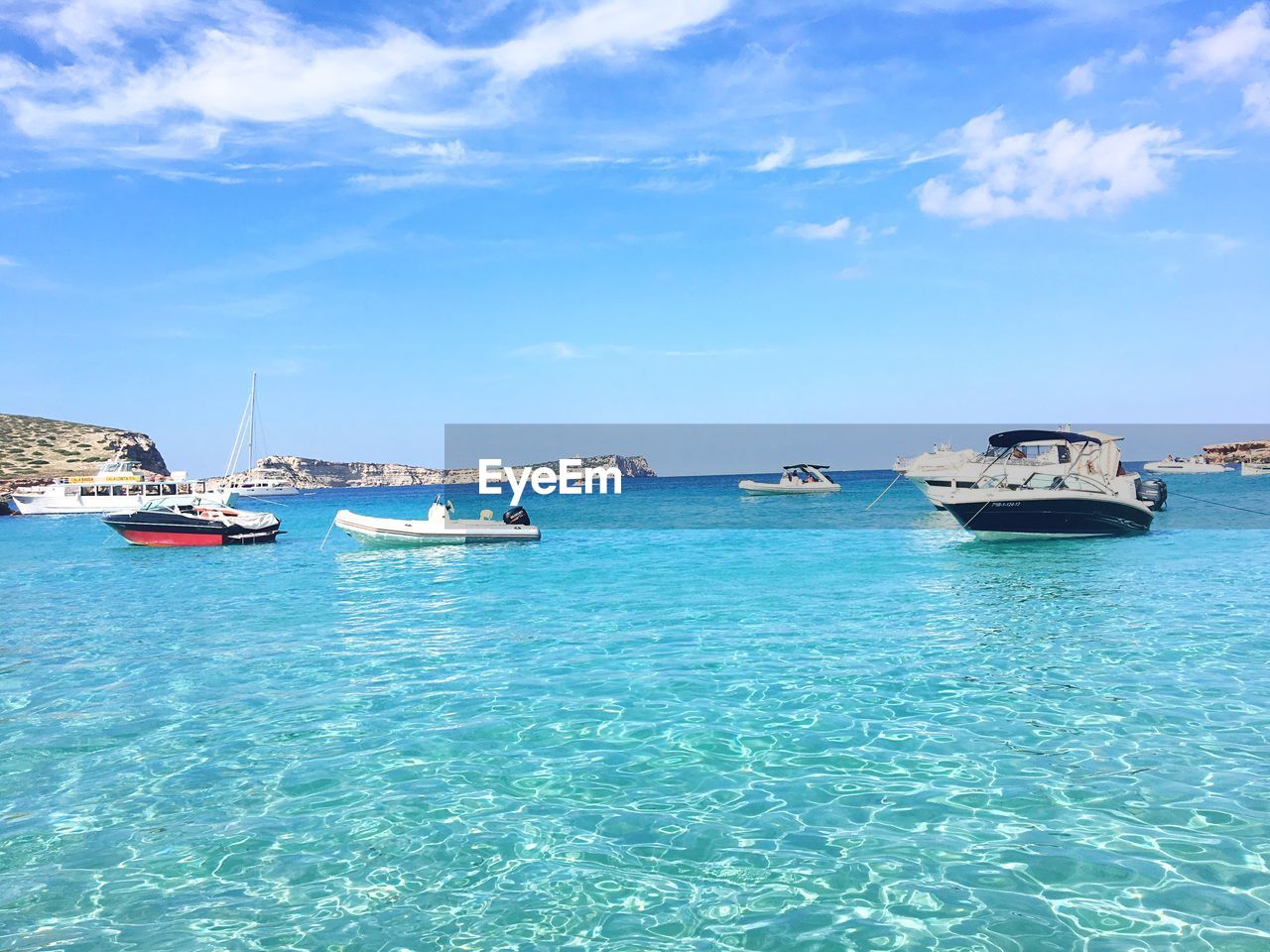 SAILBOATS IN SEA AGAINST SKY