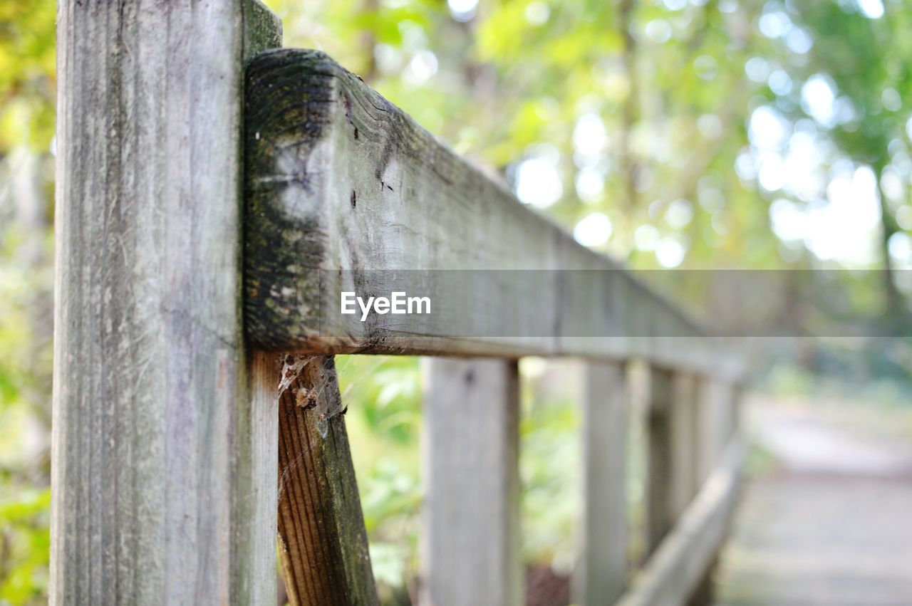 CLOSE-UP OF WOODEN RAILING