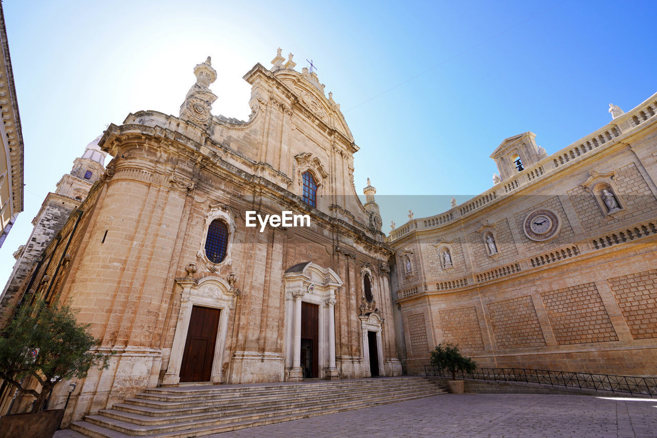 Monopoli cathedral with historic wall of the city, apulia, italy. wide angle.