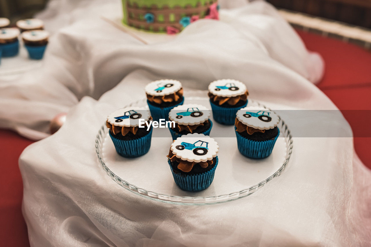 high angle view of wedding rings on bed