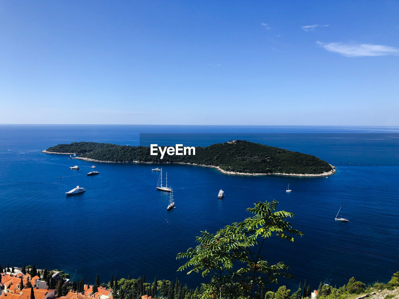 High angle view of bay against clear blue sky