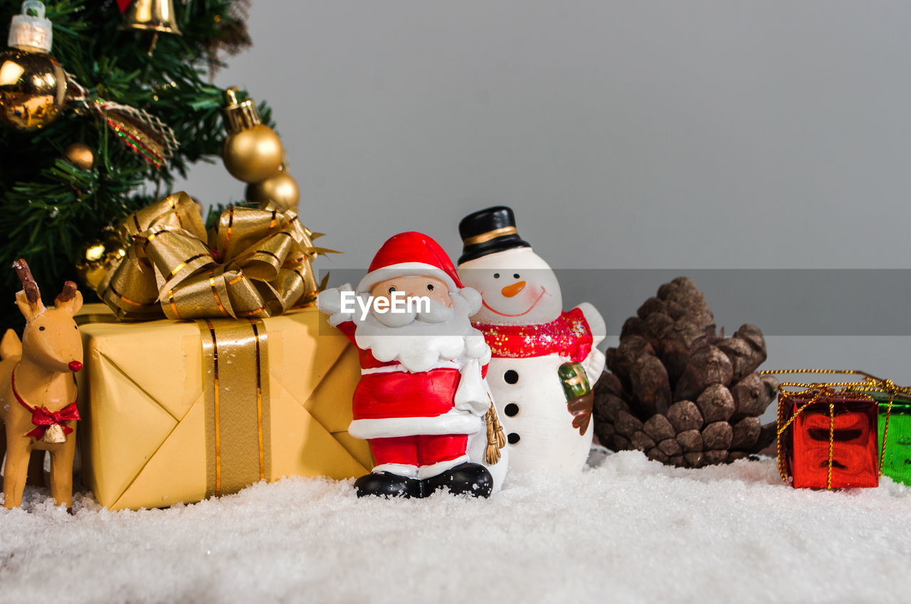 Christmas decorations with snow on table