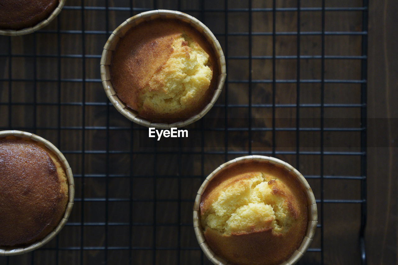 There are several delicious lemon honey cupcakes just made on the table