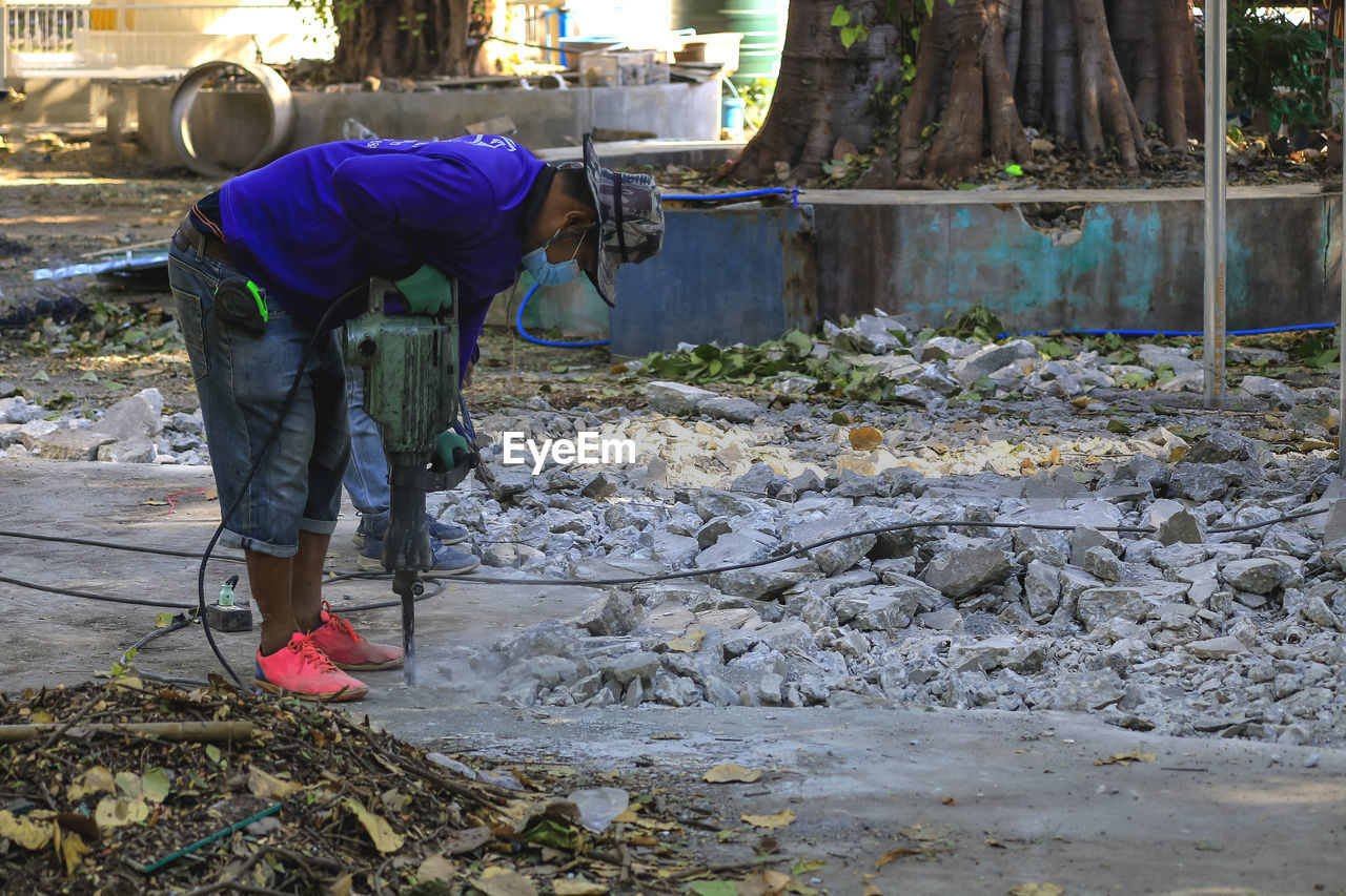 MAN WORKING WITH UMBRELLA