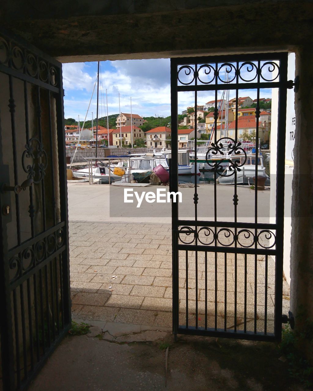 BUILDINGS SEEN THROUGH GATE