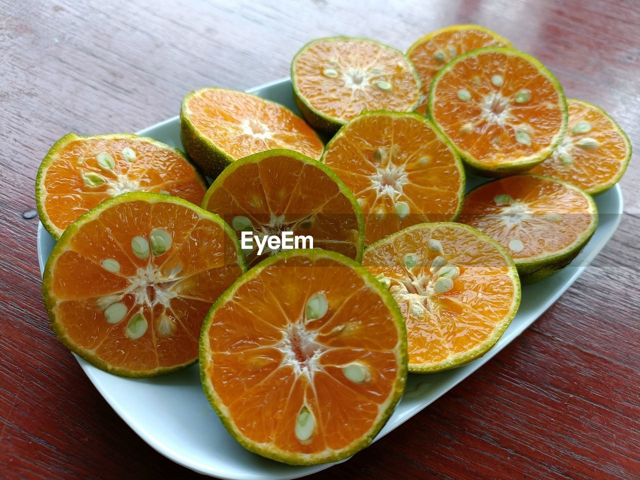 High angle view of sliced oranges on table