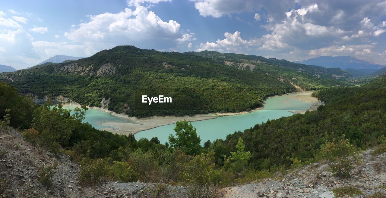 Scenic view of landscape and mountains against sky