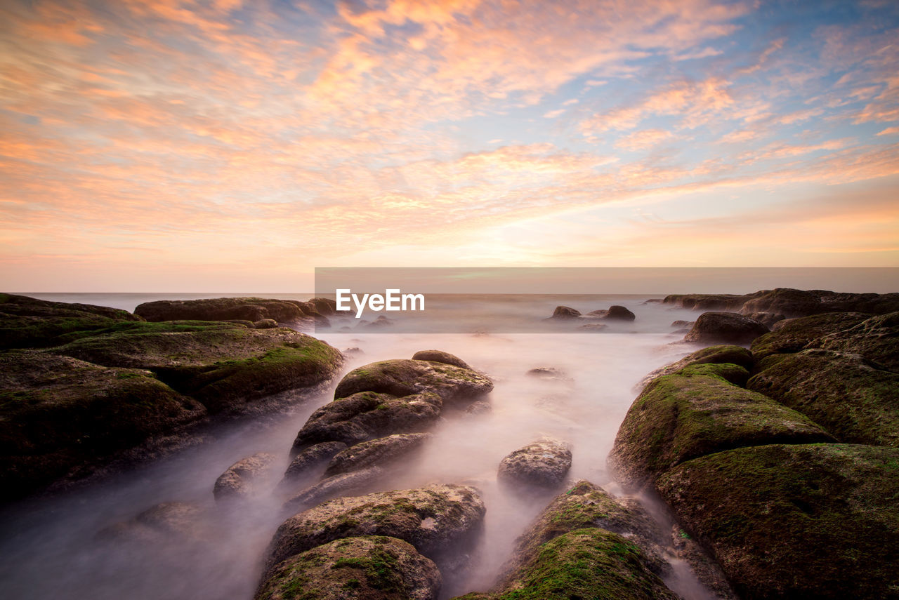 Scenic view of sea against sky during sunset