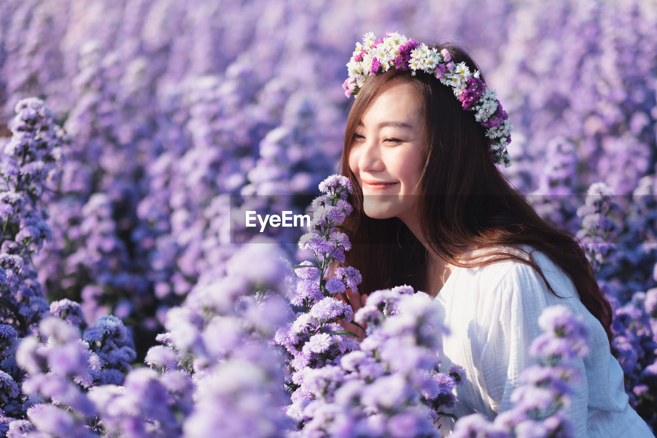 Beautiful young woman at field