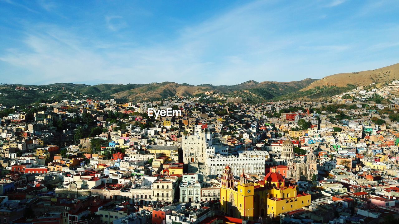 Aerial view of cityscape against sky