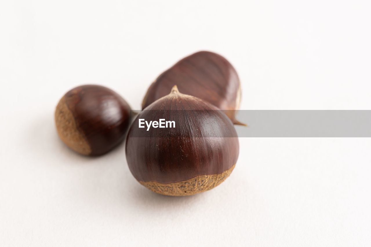 CLOSE-UP OF FRUITS OVER WHITE BACKGROUND