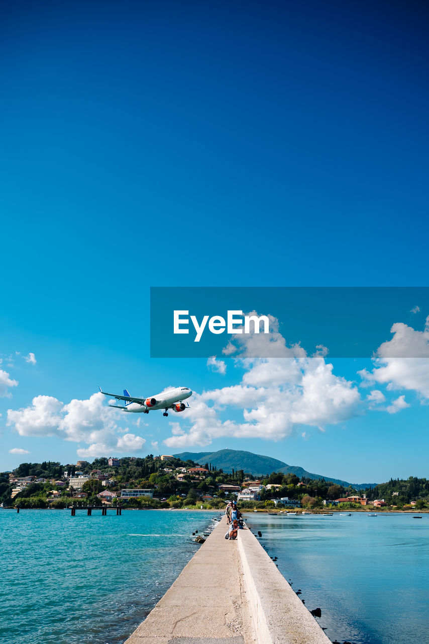 low angle view of sea against blue sky