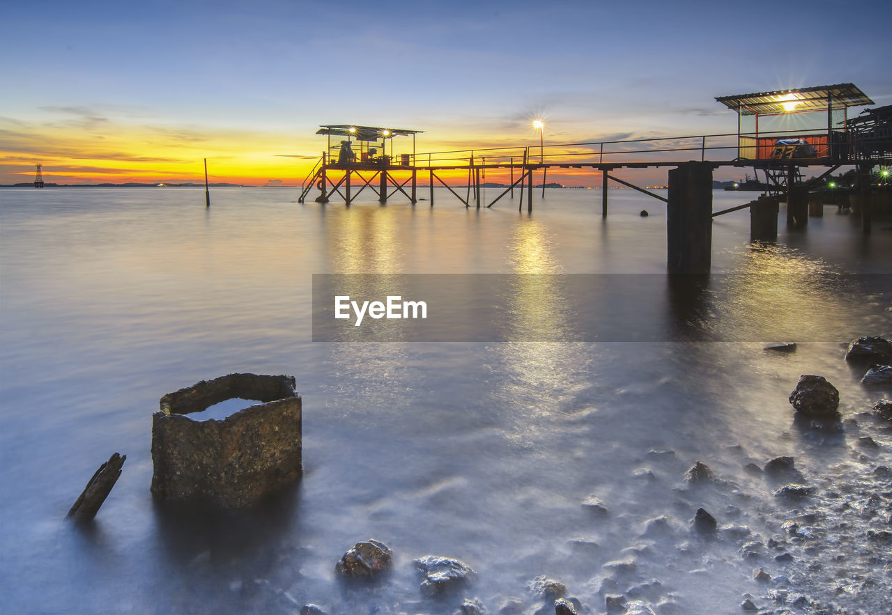 VIEW OF SEA AGAINST SKY DURING SUNSET