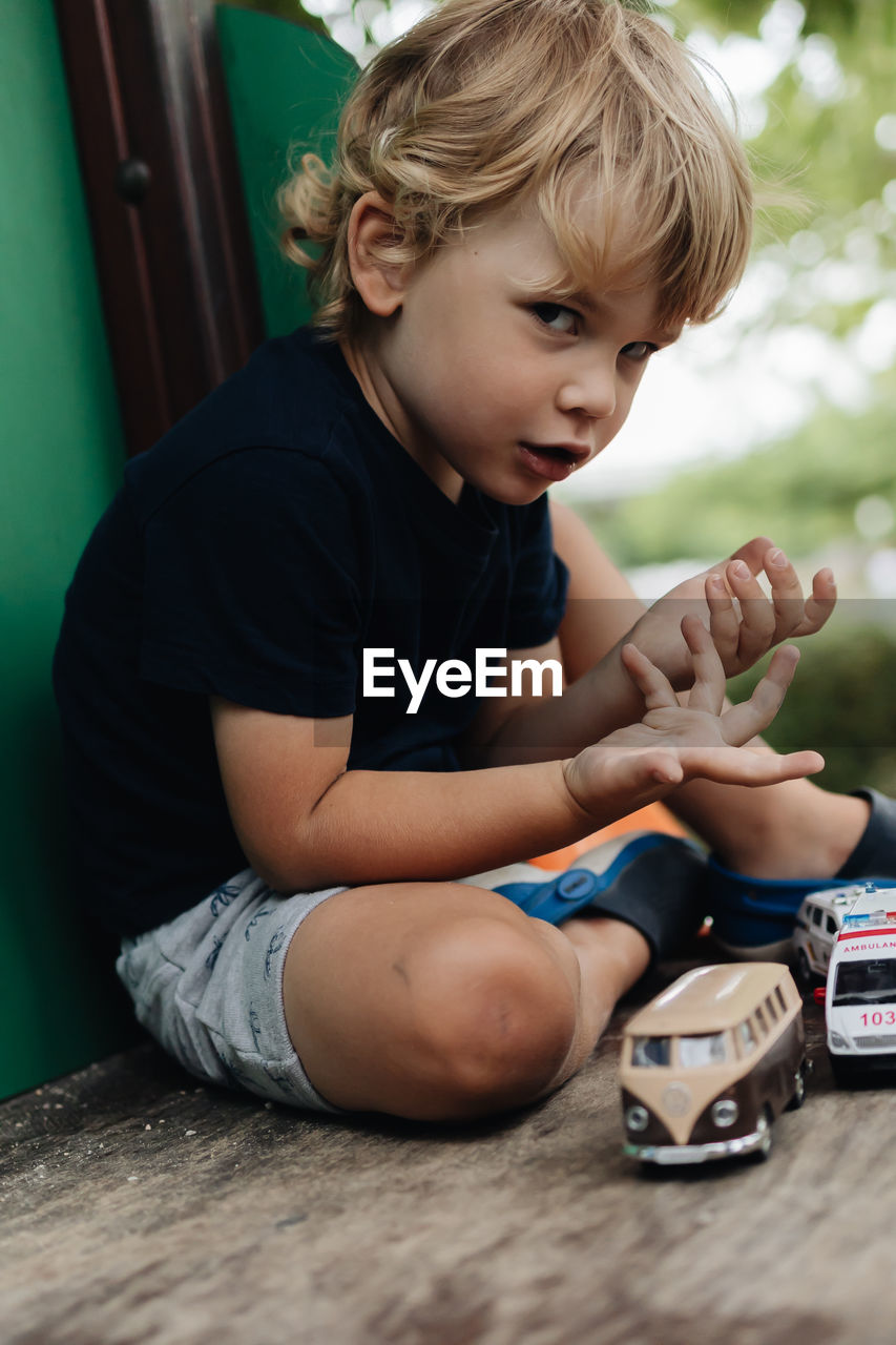 Boy playing with toy blocks