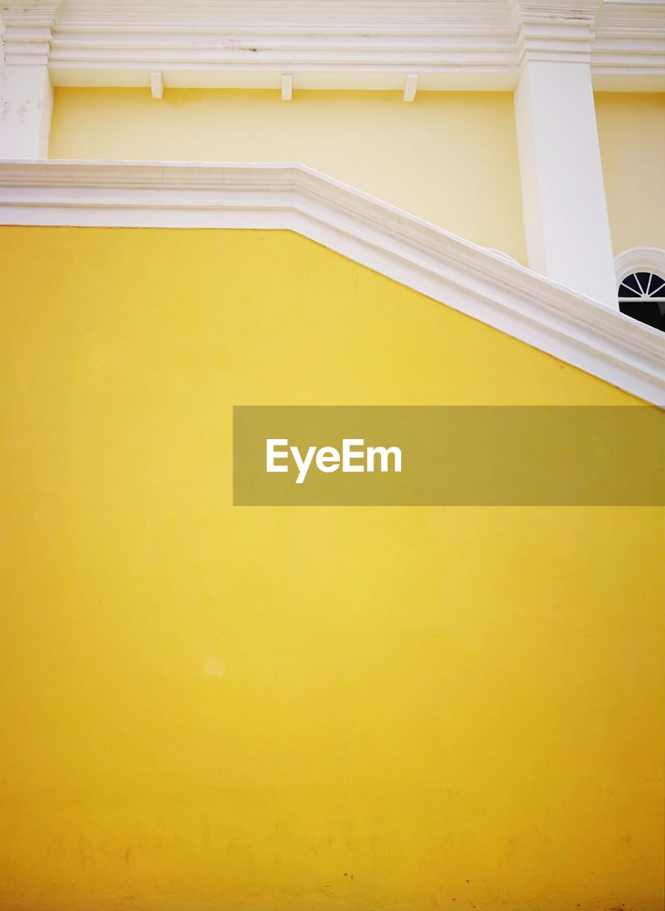 High angle view of yellow wall