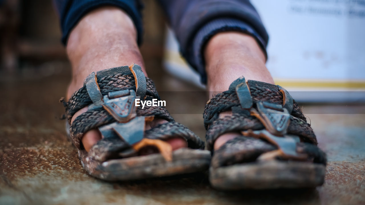 footwear, one person, shoe, adult, spring, low section, human leg, limb, close-up, human limb, sneakers, men, selective focus, human foot, lifestyles, day, indoors