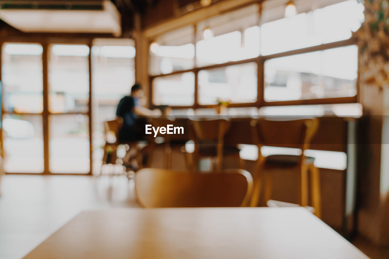 empty chairs and table at restaurant