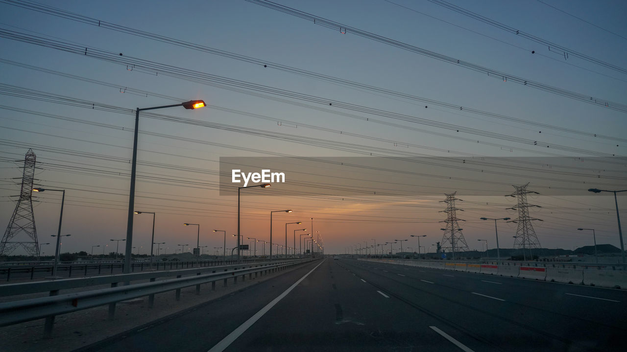 Road against sky at sunset