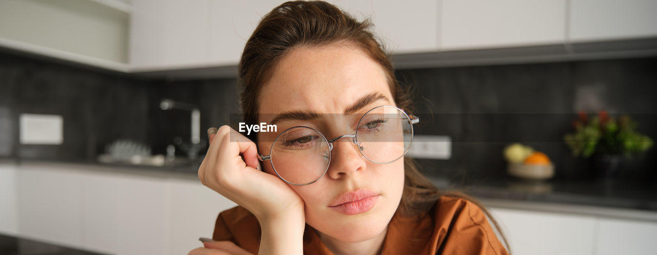 close-up of young woman with eyes closed