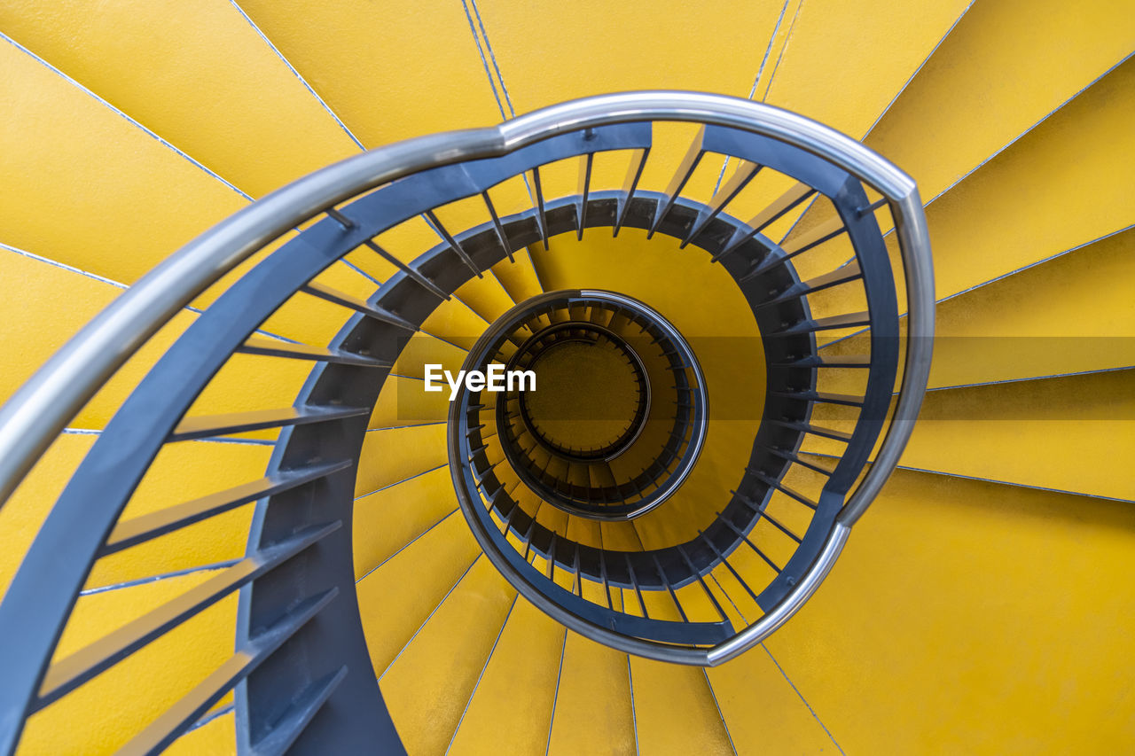 Directly above shot of spiral staircase in building