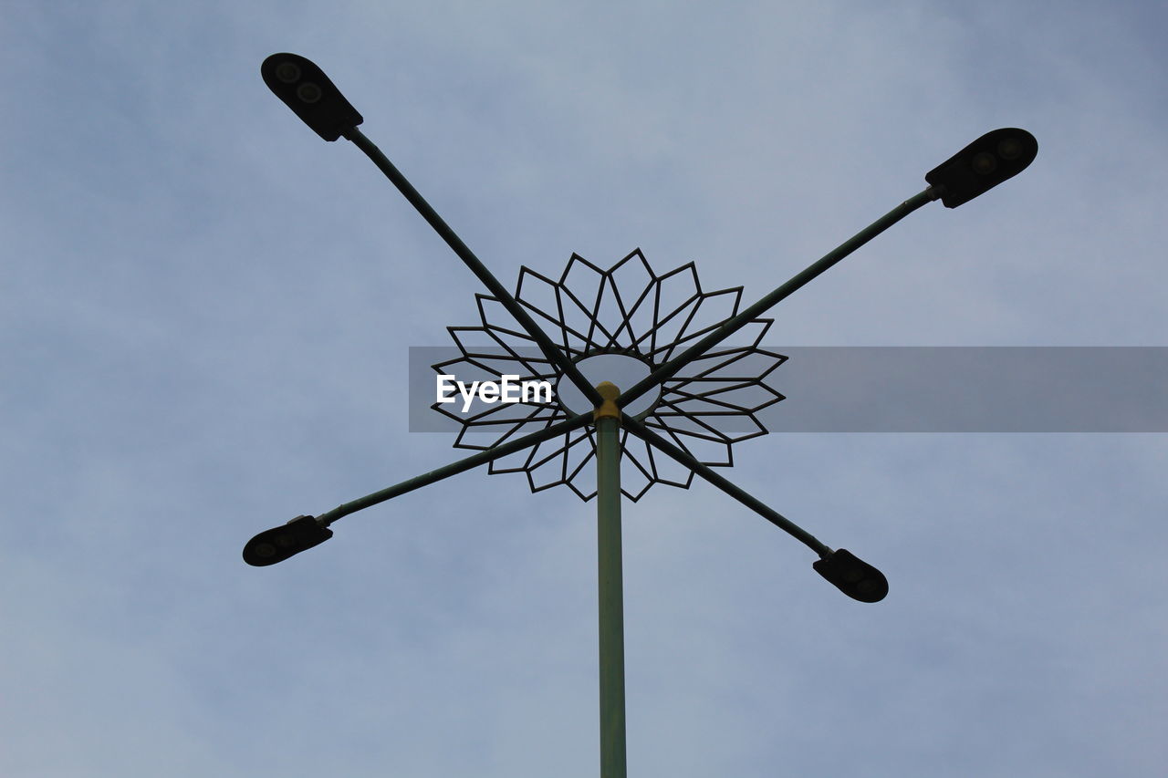 Low angle view of street light against sky