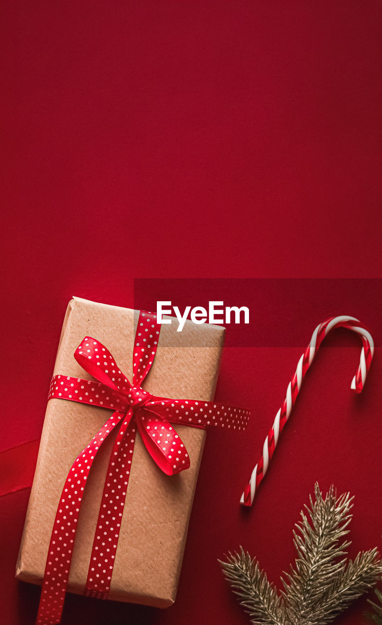 directly above shot of christmas presents on red background