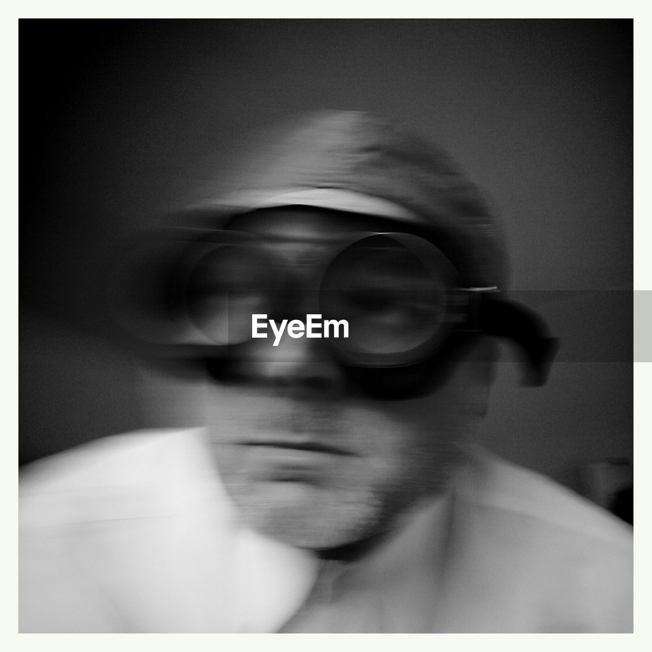 Blurred motion of man wearing swimming goggles